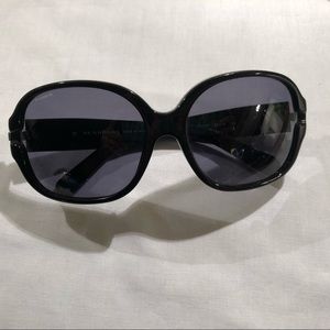 Black round designer Burberry sunglasses.